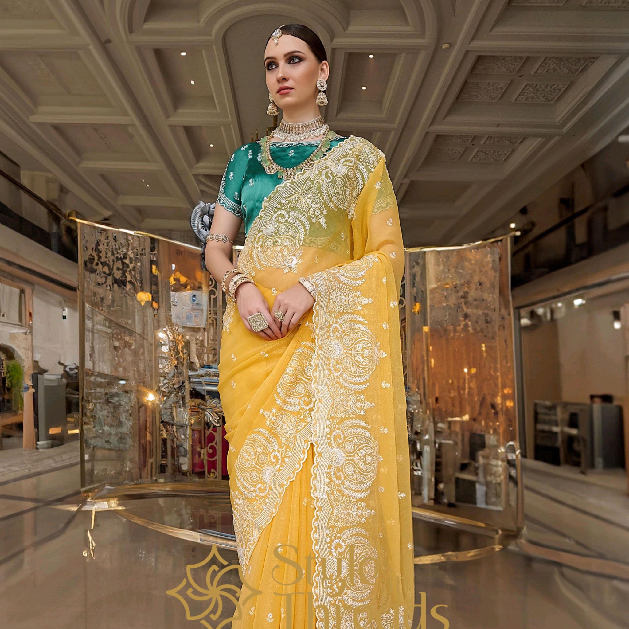 Mesmerizing Yellow Tissue Silk embellished Saree with classic turquoise green hand crafted blouse